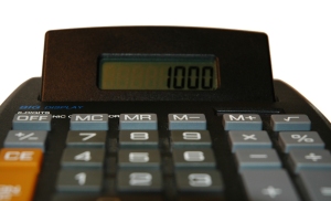 A black calculator with large buttons on white.